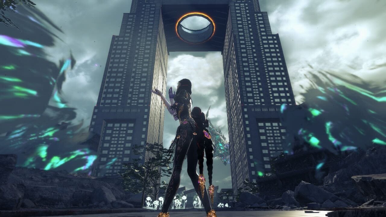 Bayonetta standing in front of two huge buildings, surrounded by green magical energy. She is clapping her hands